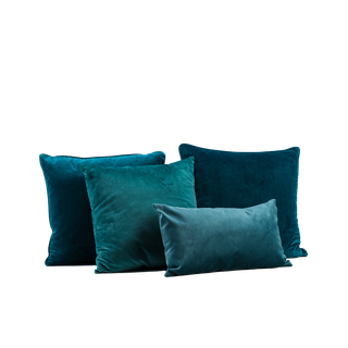 four jade blue velvet pillows