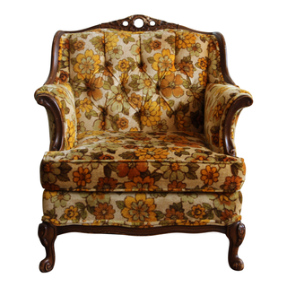 Floral orange and yellow armchair available for rent for a funky party or event 