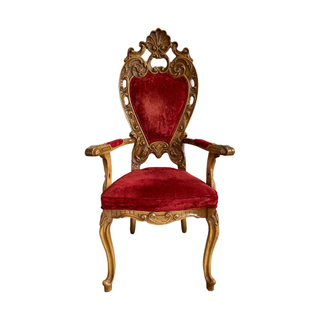 Ruby red dining chair with extravagant wood detail to take your dinner party up a notch