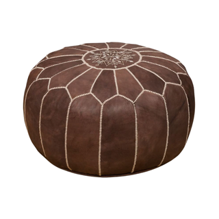 Brown leathder moroccan inspired pouf great as a neutral wedding lounge accent or for any party rental