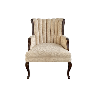 Cream tufted throne chair with dark wood accents available for event rentals from Relics Rentals