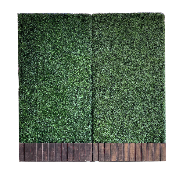 Large artificial green boxwood wall with wooden base