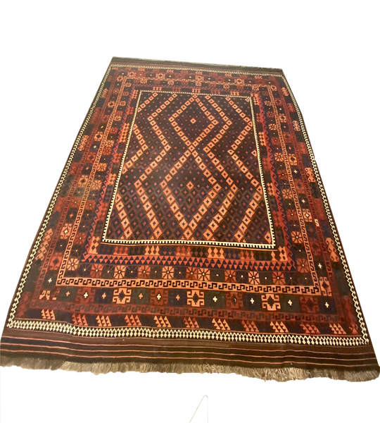 Orange, brown and rust colored persian rug in geometric pattern