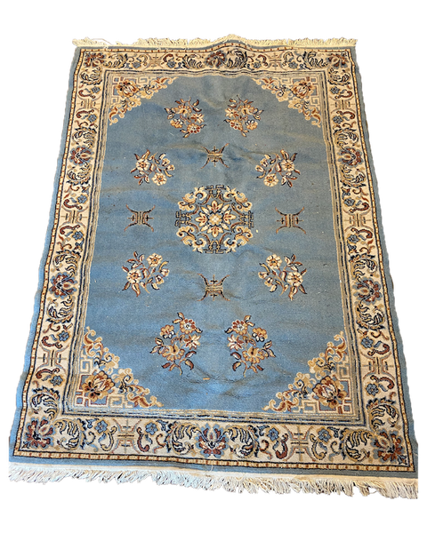 Light blue and ivory persian rug