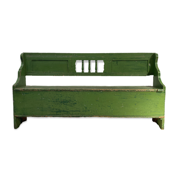 A green antique wooden bench for hire