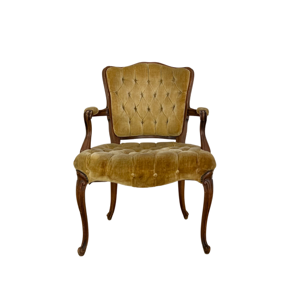 Tufted gold velvet chair with curved wooden legs