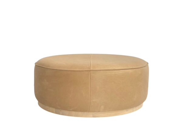 Tan leather round ottoman