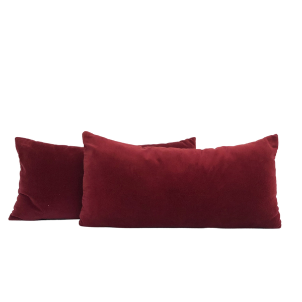 Cranberry velvet bolster pillows