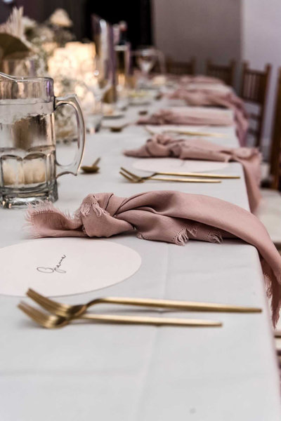 blush pink linen frayed napkin hire adelaide