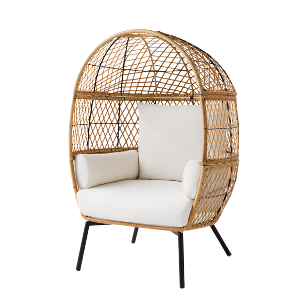 Boho wicker egg chair with black iron legs and white cushions