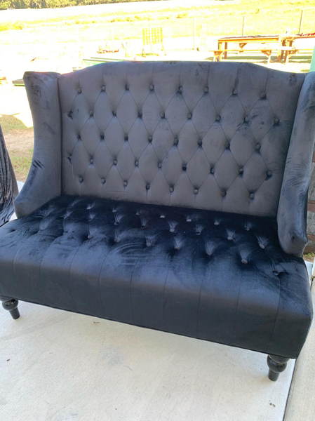 Black tuffed winged love seat