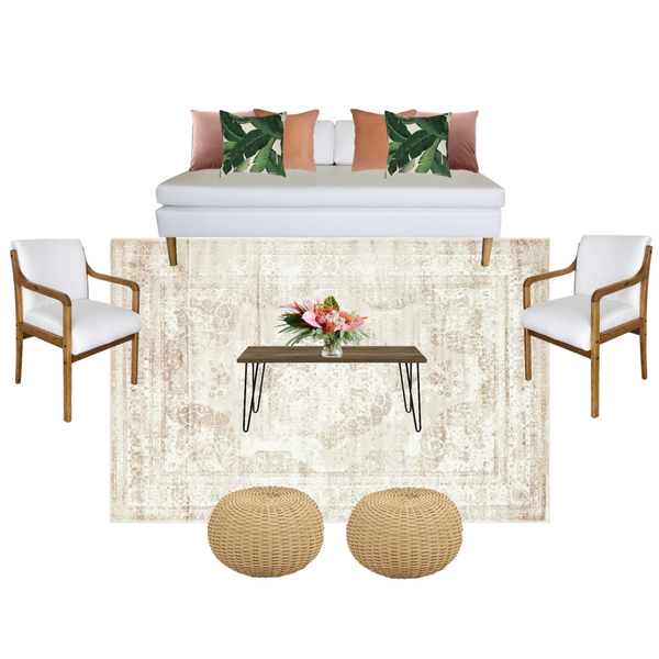 lounge set with ivory beige sofa with pillows and a wood rectangular coffee table with wood and white chairs on either side of the coffee table on a beige ivory colored pattern rug with rattan pouffs on the edge of it. 