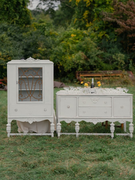 White Room china cabinet and White Wedding buffet displaying our Champagne Problems vintage coupes for after ceremony bubbly.