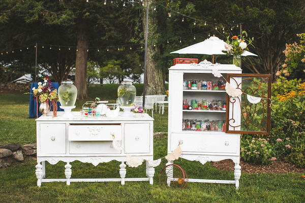 White Room china cabinet, alongside our White Wedding buffet, displaying our Gin And Juice glasses for welcome drinks.