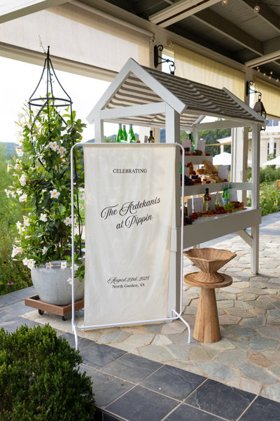 white wooden market stand shelf rental with gray and white striped awning 
