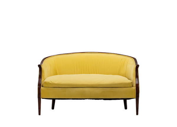 yellow velvet loveseat with wood trim and feet