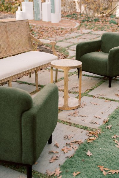 pair of olive green arm chairs as event decor rentals