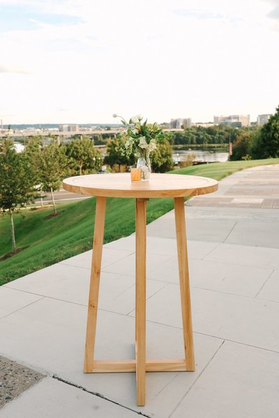 light wood contemporary cocktail table event rental