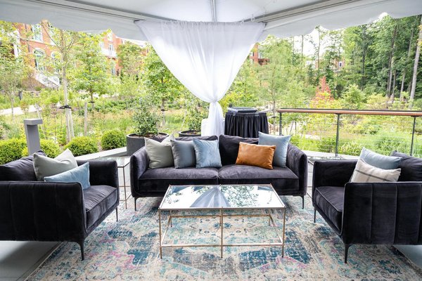 event lounge with dark gray velvet armchair rentals
