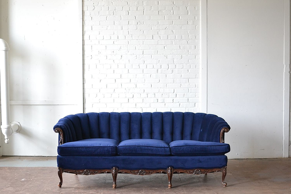 wingback sofa wood trim dark blue upholstered