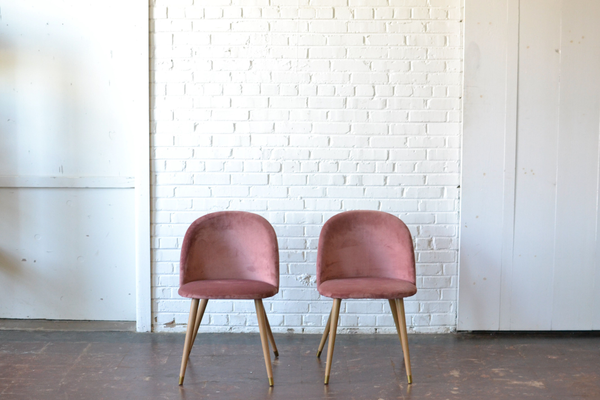 blush pink velvet chairs with wooden legs