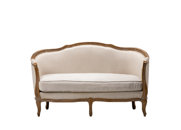 curved back settee upholstered in neutral linen with a wood trim