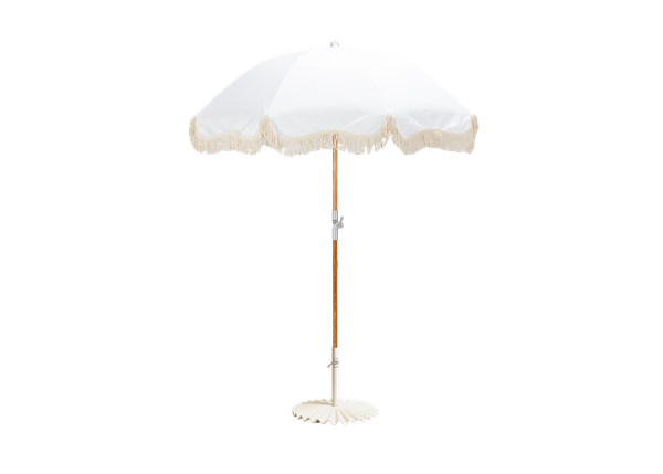 white umbrella with fringe trim in a white scalloped base