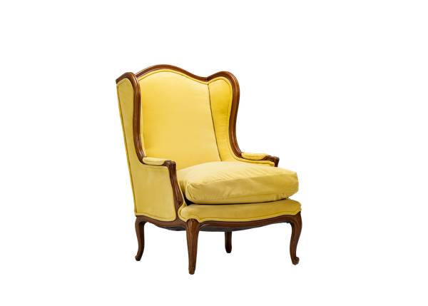 yellow velvet wingback chair with wood trim