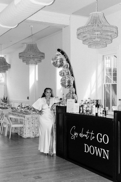black shadowbox bar rental with custom vinyl on bar front