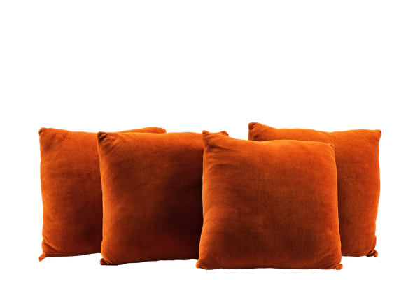 four terracotta orange square pillows 