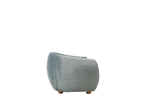side view of curved dusty blue velvet sofa event rental