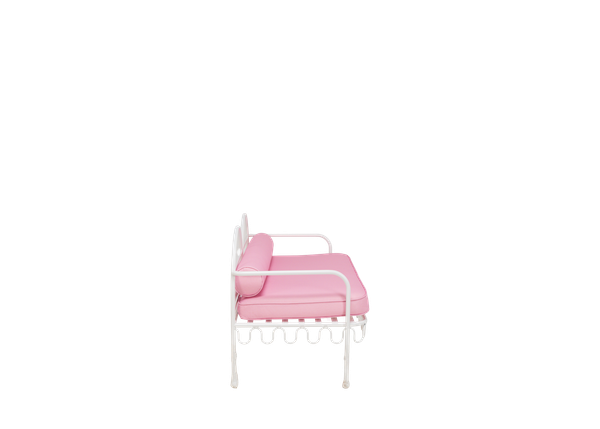 side view of eclectic white curved metal settee rental for events with pink cushions