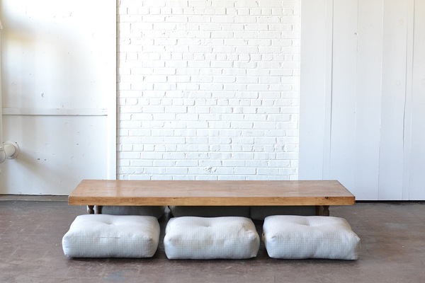 low-set table and neutral gray floor cushions