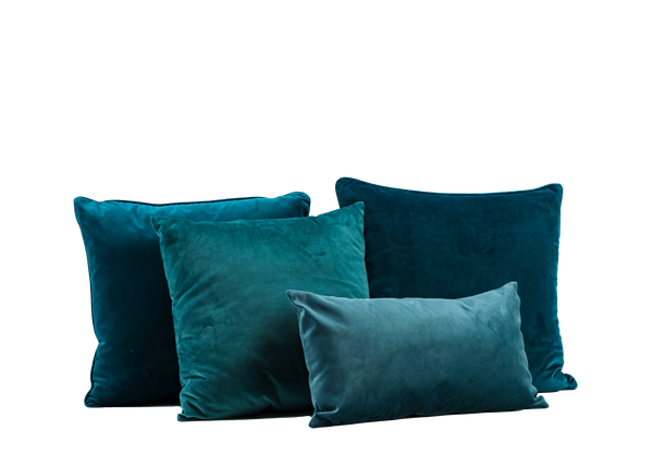 four jade blue velvet pillows