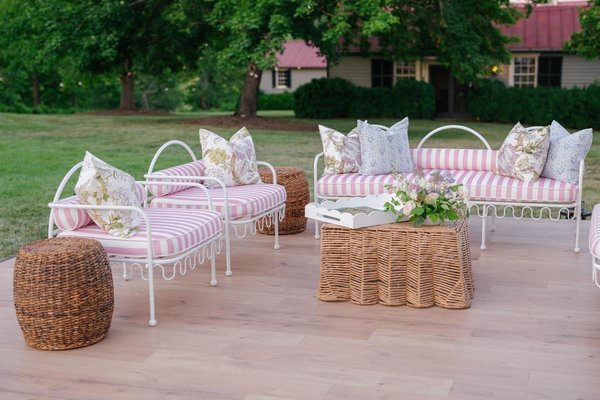 lounge seating area at wedding with square seagrass coffee table