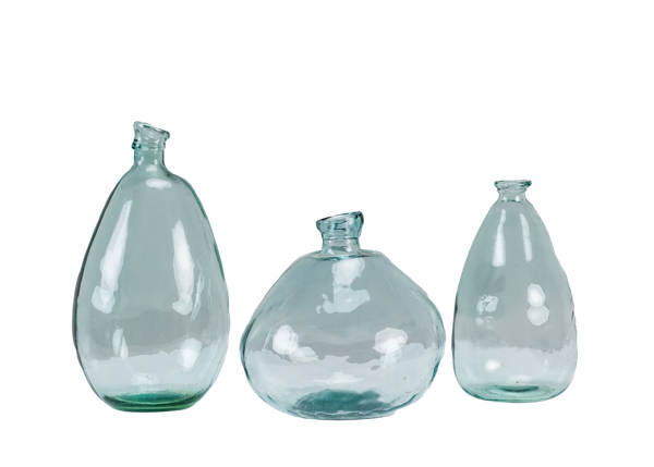 trio of turquoise glass vessels of varying shapes and sizes