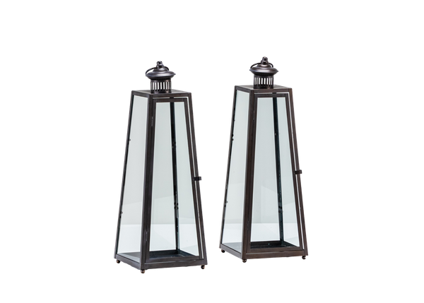 pair of angled black metal and glass lanterns