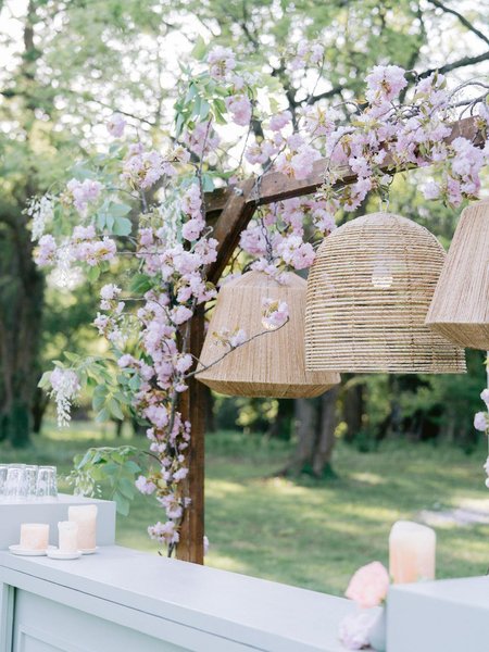 assortment of rattan and jute chandeliers as rental event decor