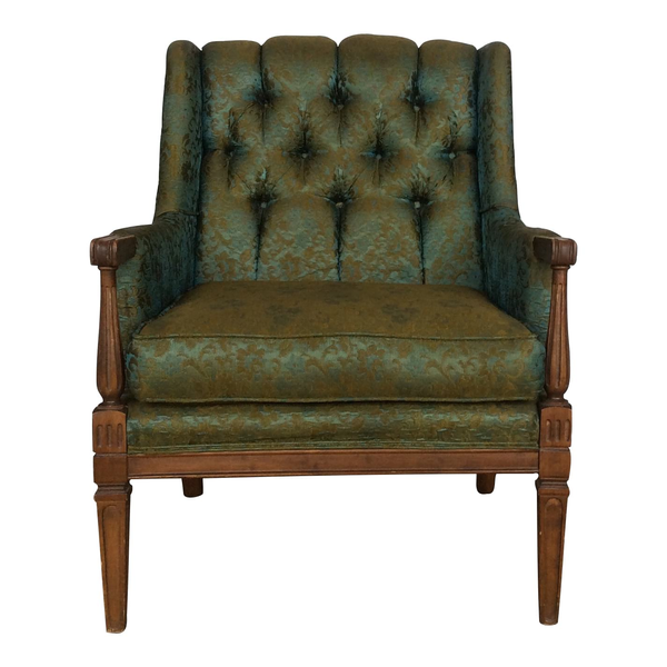 Tufted patterned green lounge chair with wood legs and arms