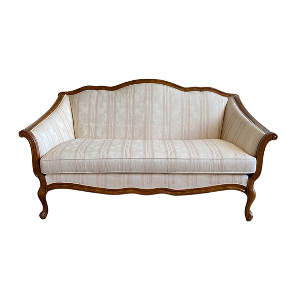 Cream and blush stripped settee with dark wood accents