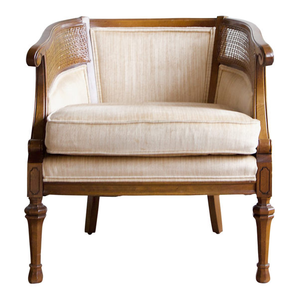 Vintage regency chair with cane detail and neutral upholstry