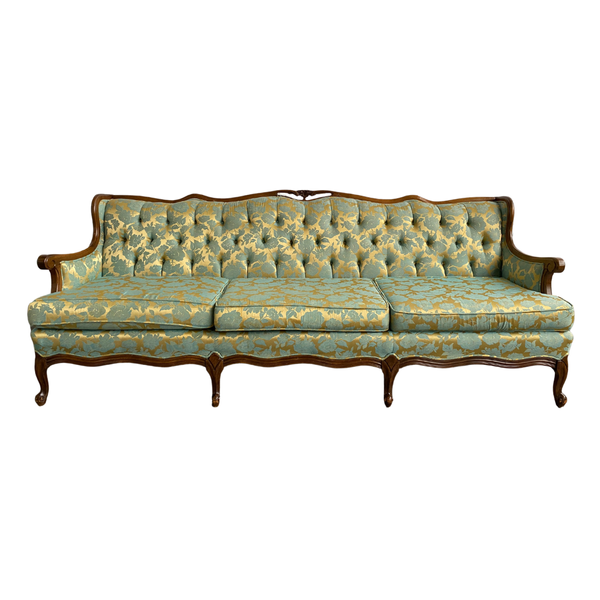 One of a kind blue and gold floral patterned sofa with carved wood details