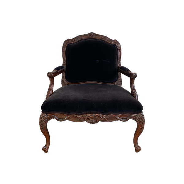 Large black velvet thrown chair available from Relics Rentals for event rentals