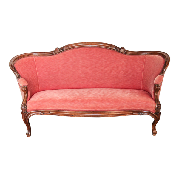 Peach colored settee with smooth lines for event rentals from Relics Rentals