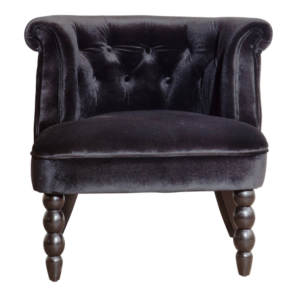 Leather tufted low back chair that is small and great in a wedding lounge 