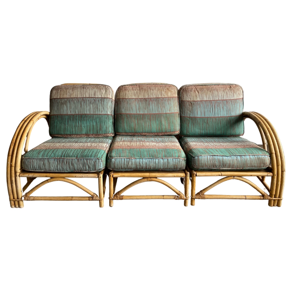 Sofa with rattan base and blue green cushions can give any event a tropical tiki vibe