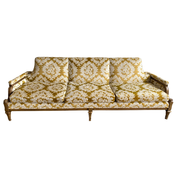 Yellow and white patterned sofa with 70s vibes perfect for party and event rentals 