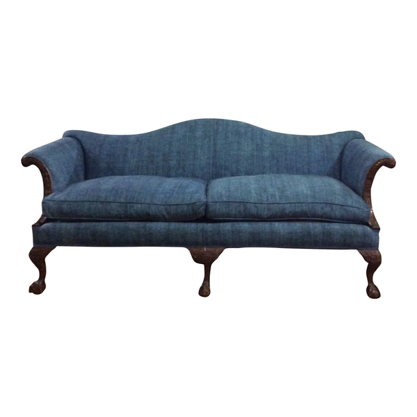 Simple blue sofa with dark wood details available for wedding and event rentals