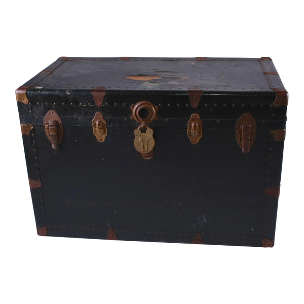 Black trunk with rusted details for a chic lounge side table or coffee table