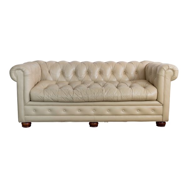 Tan tufted chesterfield couch availble for event rentals and weddings
